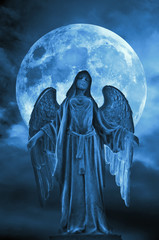 angel archangel of night and Moon in blue tonality like religious, mystic and spiritual concept 