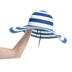 Blue beach hat travel in hand on white background isolation