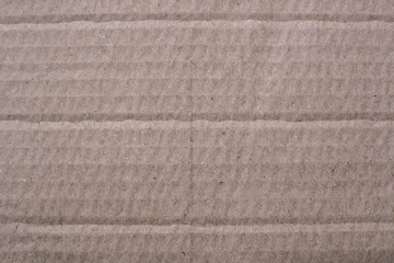 Fototapeta premium Thick paper, cardboard beige color with a pronounced texture, backdrop for design