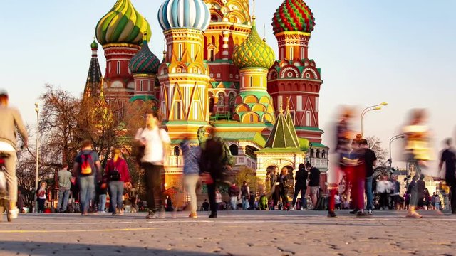 Moscow, Russia-april 24, 2019. Red Square and St. Basil's Cathedral.  Tourists walk and make photo on red square. Motion timelapse. Time lapse people. 8K. 4K.