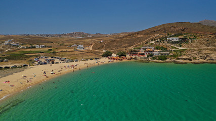 Aerial drone photo of famous tropical bay and beach of Ftelia in the centre of island of Mykonos, Cyclafes, Greece