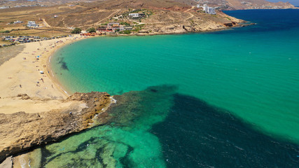 Aerial drone photo of famous tropical bay and beach of Ftelia in the centre of island of Mykonos, Cyclafes, Greece