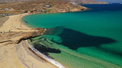 Aerial drone photo of famous tropical bay and beach of Ftelia in the centre of island of Mykonos, Cyclafes, Greece