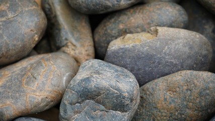 Fototapeta na wymiar Close up rounded gray gravel texture, River Stone Background