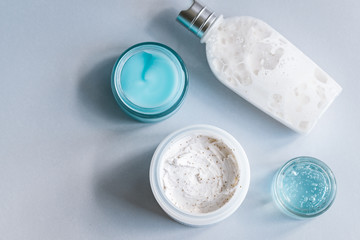 Female skin and body care cosmetic products set flatlay. Overhead, minimalism, beauty blogging concept