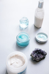 Female skin and body care cosmetic products set flatlay. Overhead, minimalism, beauty blogging concept