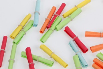 heap of colorful tombola tickets are lying in the white studio