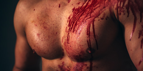 Pain and injury. Body soiled blood. Mutant concept. Psycho mad man. Murderer brutal aggressive guy. Aggressive person. Injured soldier. Chest muscular torso with bloody streams. Pain and gain - obrazy, fototapety, plakaty