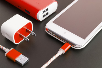 smartphone battery and usb charging cable with copy space