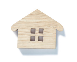 Obraz na płótnie Canvas small wooden toy wood house symbol isolated on white