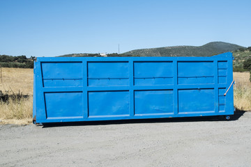 Truck haul truck in blue color resting on the ground
