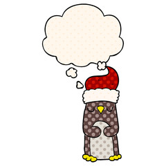 cartoon christmas penguin and thought bubble in comic book style