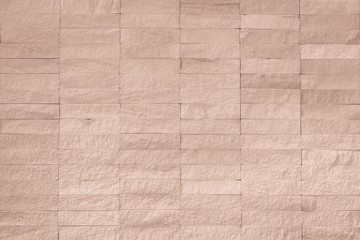 Fototapeta premium Rock tile wall texture background in light red brown