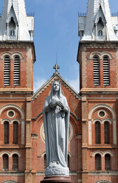 Statue of Virgin Mary stands outside Notre Dame Cathedral in Ho Chi Minh