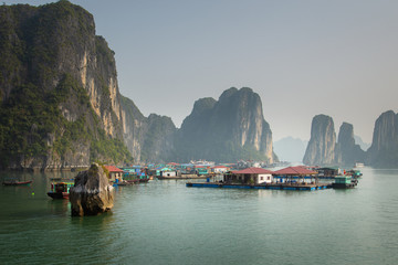 Fototapeta na wymiar The Floating Village at the waters of Ha Long Bay, Vietnam