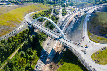 Aerial view of a new suspension bridge above roadworks (A465, Wales)