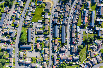 Aerial drone view of small winding sreets and roads in a residential area of a small town