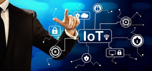 IoT security theme with businessman on a dark blue background