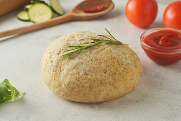 Composition with raw dought and fresh ingredients for pizza isolated on white background. Copy space. Flat lay food ingredients.