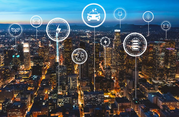 EV with downtown Los Angeles at night