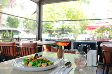 Pasta painted with organic paint, stuffed mussels, squid and rose wine