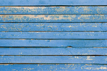 wooden background, old wooden wall, painted blue, with slits