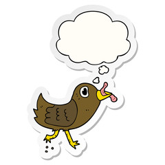 cartoon bird with worm and thought bubble as a printed sticker