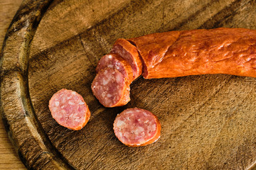 Sliced sausage on cutting board