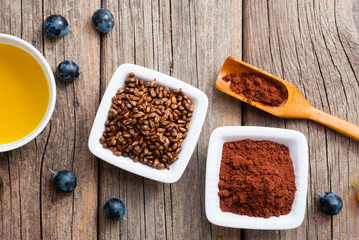 grape seed oil, grist and bunches on old wood