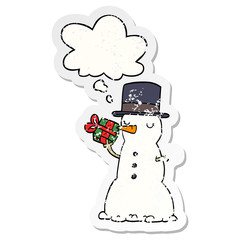 cartoon snowman and thought bubble as a distressed worn sticker