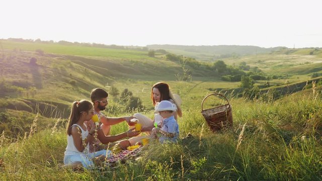 Happy family spends time on a picnic