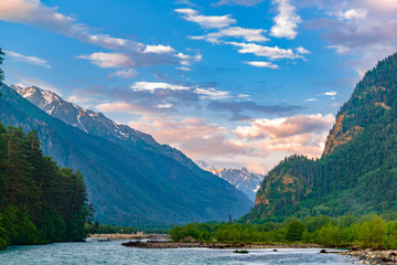 Fototapeta na wymiar The river flows in a deep gorge, the mountains of Caucasus.