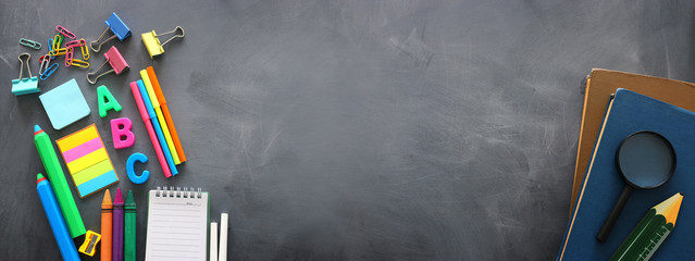 education and back to school concept. stationery over classroom blackboard. top view, flat lay © tomertu