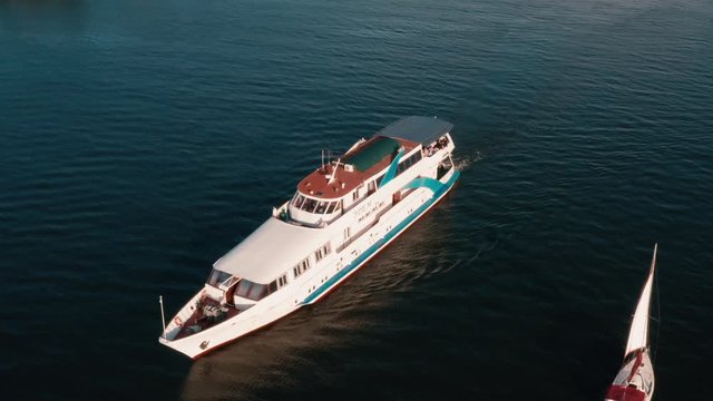 Drone view 4K Span along the yacht suddenly in the frame enters the boat