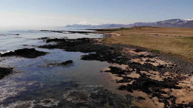 Iceland drone footage on the Ytri Tunga seal beach near the ocean in beautiful sunny spring weather