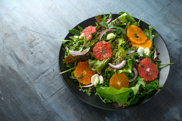 Orange and grapefruit Citrus salad with lentills vertes, wild rocket, arugula, red onion and sprinkle of pumpkin seeds