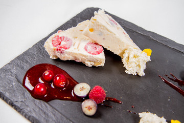 Semifreddo with seasonal fruit and rapsberry sauce