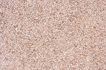 The texture of stone gravel, stone powder for facades. The concept of repair and exterior finish.