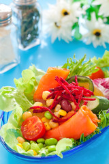 Fresh salad with smoked salmon.