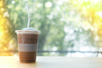 Iced mocha coffee on wooden table
