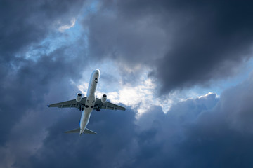 Naklejka premium Passenger aircraft on the background of clouds.