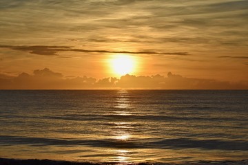 Sunrise over clouds and ocean