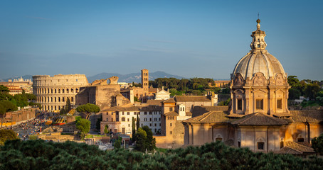 Fototapeta na wymiar Sunset view of Colosseum and Roman Forum in Rome.