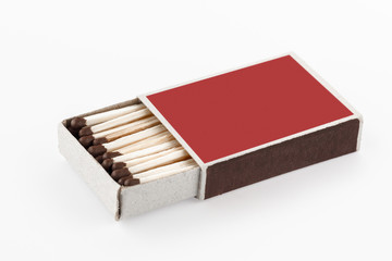 The open box of matches on white background. Side view. Blank space.