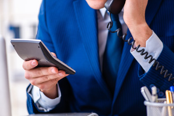 Young businessman sitting and working in the office