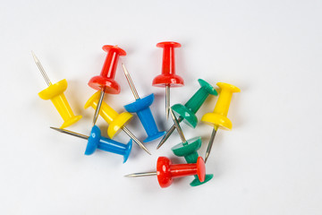 colorful pins on white background