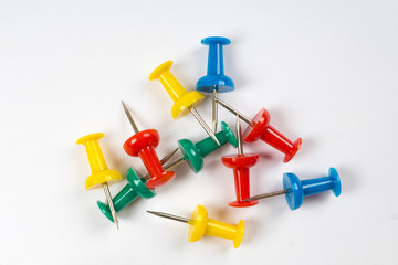 colorful pins on white background