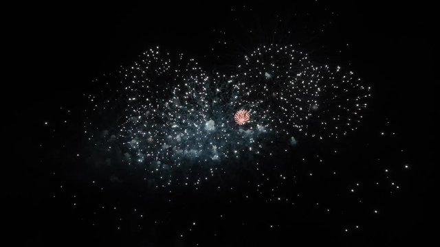 Real Fireworks footage 4k video on Deep Black Background Sky on Futuristic Fireworks festival show before independence day on 4 of July