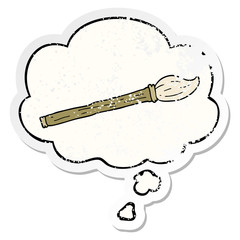cartoon paint brush and thought bubble as a distressed worn sticker