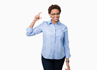 Young beautiful african american business woman over isolated background smiling and confident gesturing with hand doing size sign with fingers while looking and the camera. Measure concept.